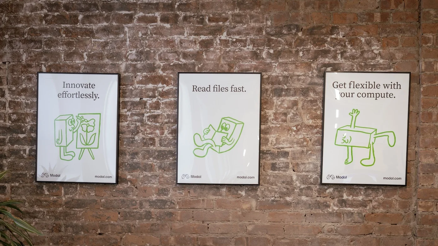 three posters on the Modal office wall